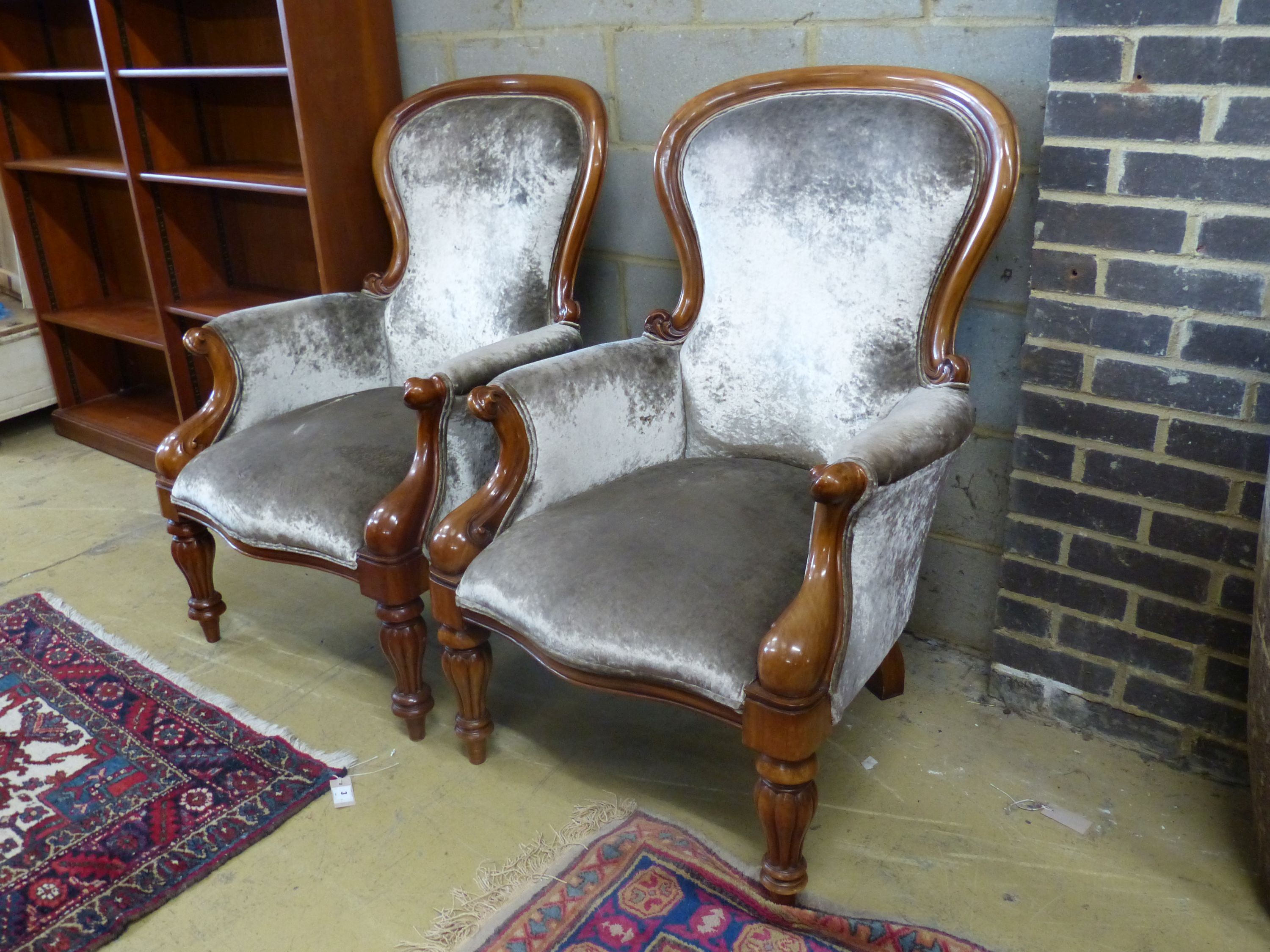 A pair of reproduction Victorian style mahogany spoonback armchairs, width 71cm depth 80cm height 108cm